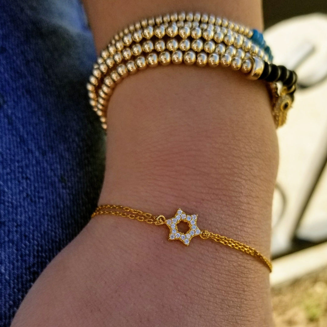 14K Gold Bracelet with Chai, Evil Eye and Star of David Charms